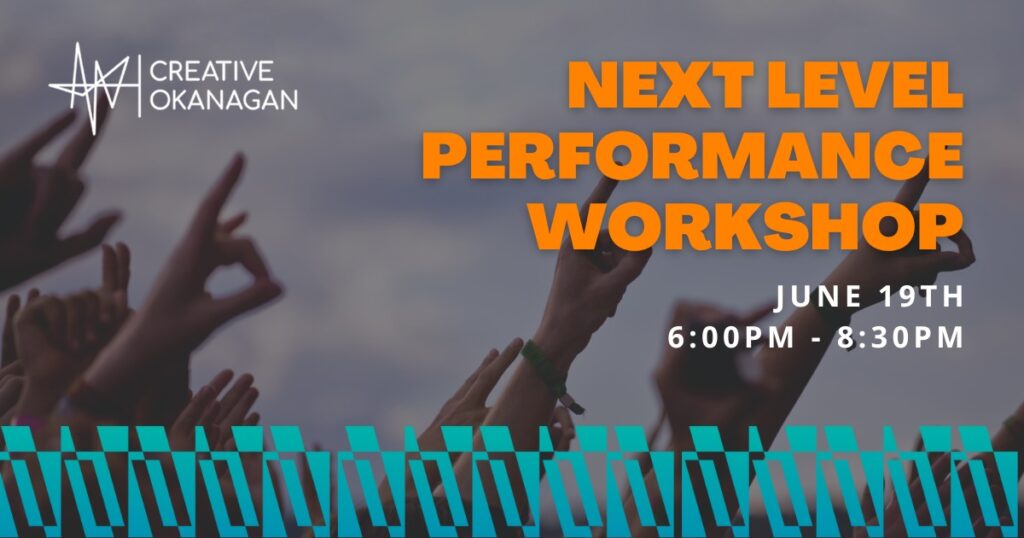 Audience members hands up as they enjoy live music.